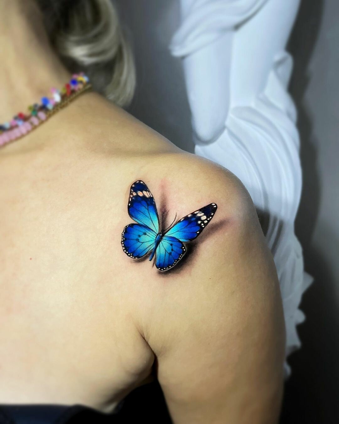 Blue 3D butterfly tattoo